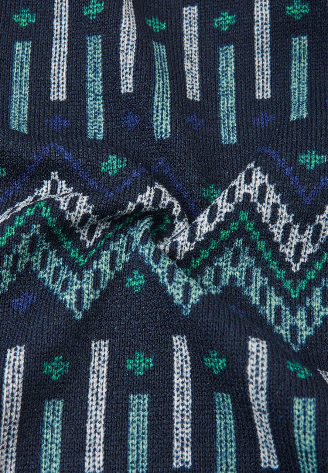 Reima Myytti Fleece Overall fabric featuring a colorful Nordic pattern in blue, green, and white tones.