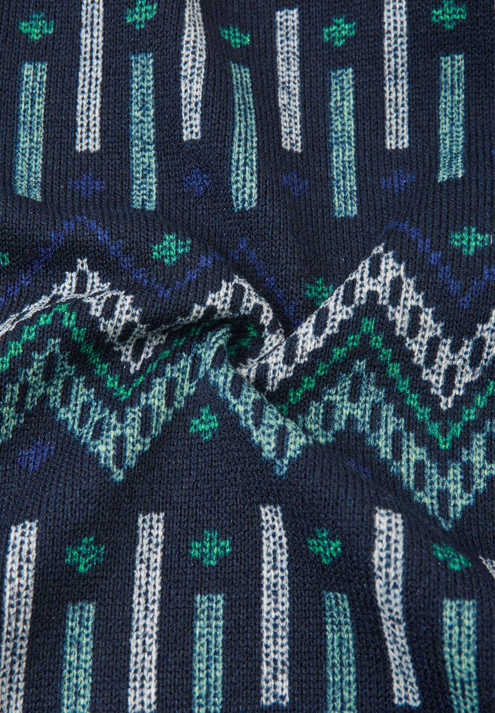 Reima Myytti Fleece Overall fabric featuring a colorful Nordic pattern in blue, green, and white tones.